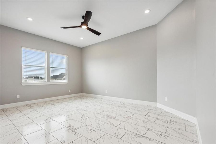 Empty room with a ceiling fan, baseboards, and recessed lighting