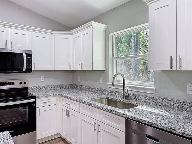 Furnished interior view inside a new home in , Dunnellon (Image 27).