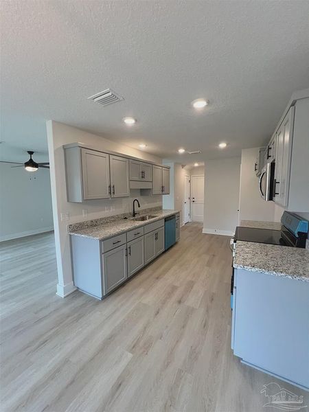 Furnished interior view inside a new home in Pine Top, Cantonment (Image 6).