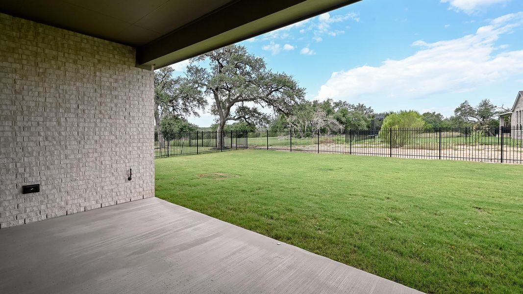 Fenced backyard featuring a patio area