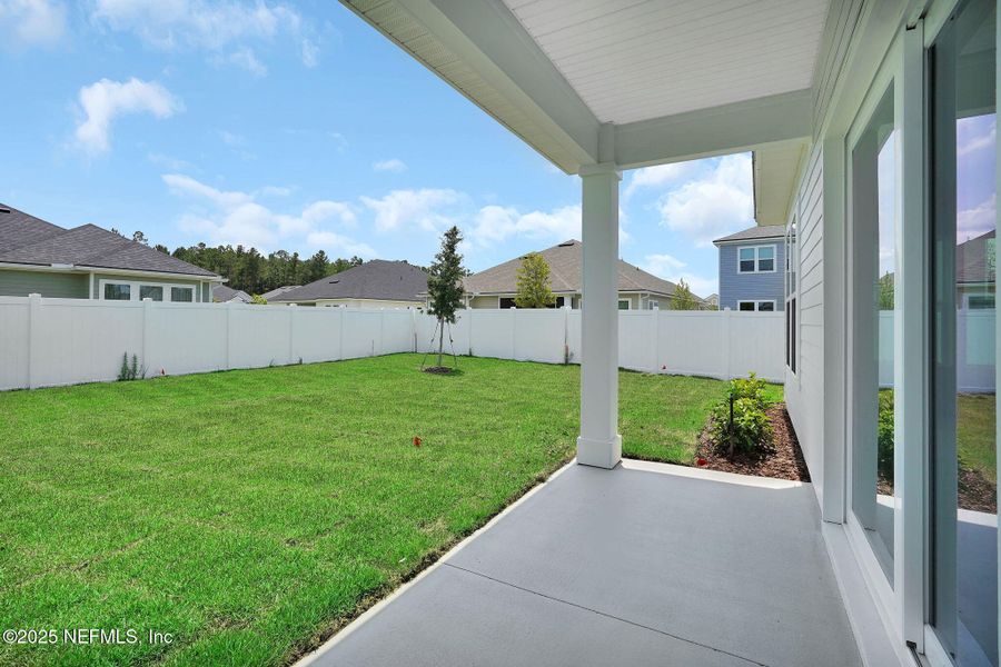 Exterior details and patio area of a home in Forest Park at Wildlight, Yulee (Image 26).