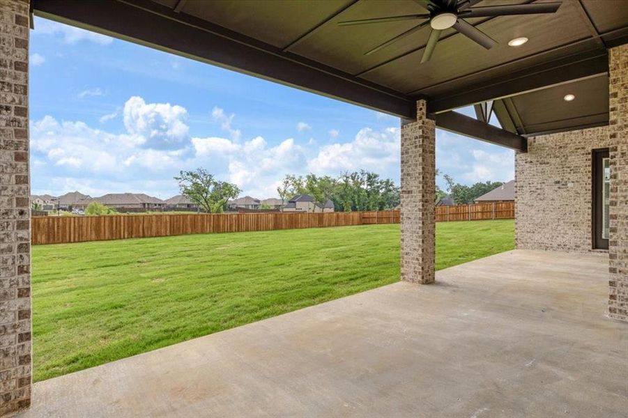 View of patio featuring ceiling fan