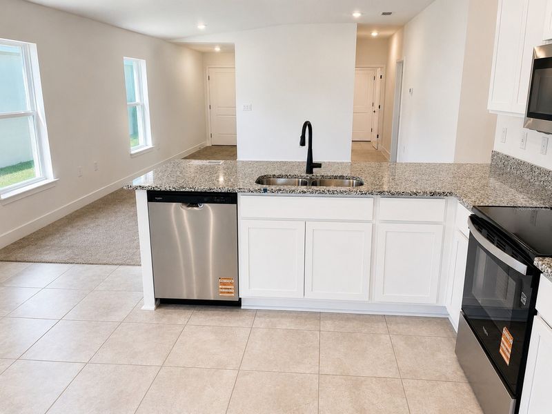 Furnished interior view inside a new home in Harmony Central, St. Cloud (Image 5).