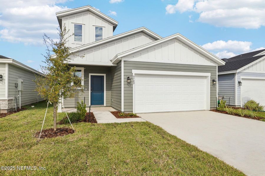 Front exterior of a new home in Cypress Meadows - Classic Series, Jacksonville, FL, highlighting curb appeal (Image 2).