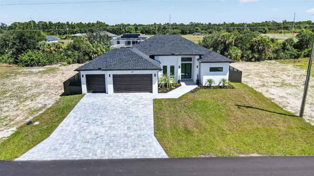 Front exterior of a new home in , Cape Coral, FL, highlighting curb appeal (Image 31). Front exterior of a new home in , Cape Coral, FL, highlighting curb appeal (Image 31).