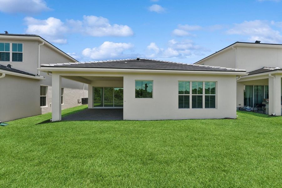 Front exterior of a new home in Salerno Reserve - Single Family, Stuart, FL, highlighting curb appeal (Image 24). Front exterior of a new home in Salerno Reserve - Single Family, Stuart, FL, highlighting curb appeal (Image 24).