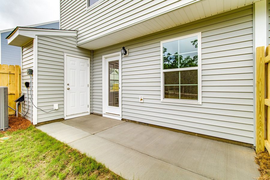 Exterior details and patio area of a home in Padgett Commons, Hopkins (Image 3).