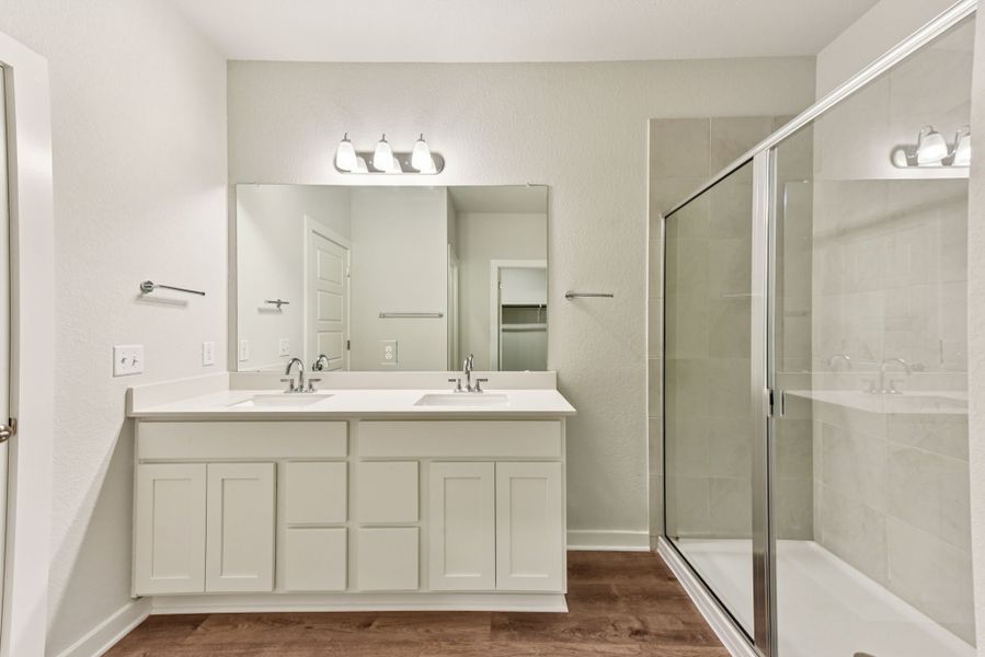 A bathroom with a glass shower.