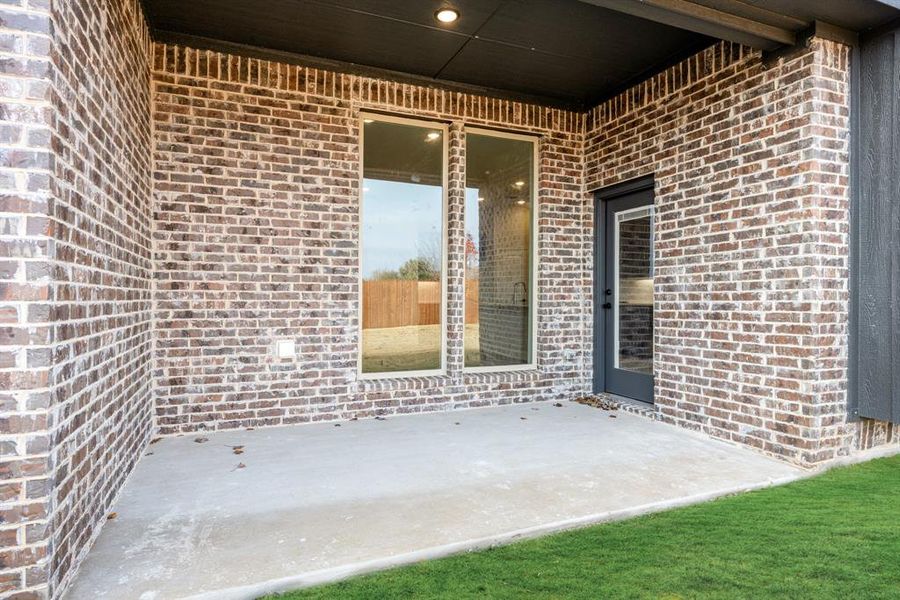 Exterior details and patio area of a home in The Retreat at North Grove 60, Waxahachie (Image 21).