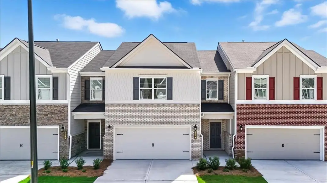 Front exterior of a new home in Park Center Pointe, Austell, GA, highlighting curb appeal (Image 1).