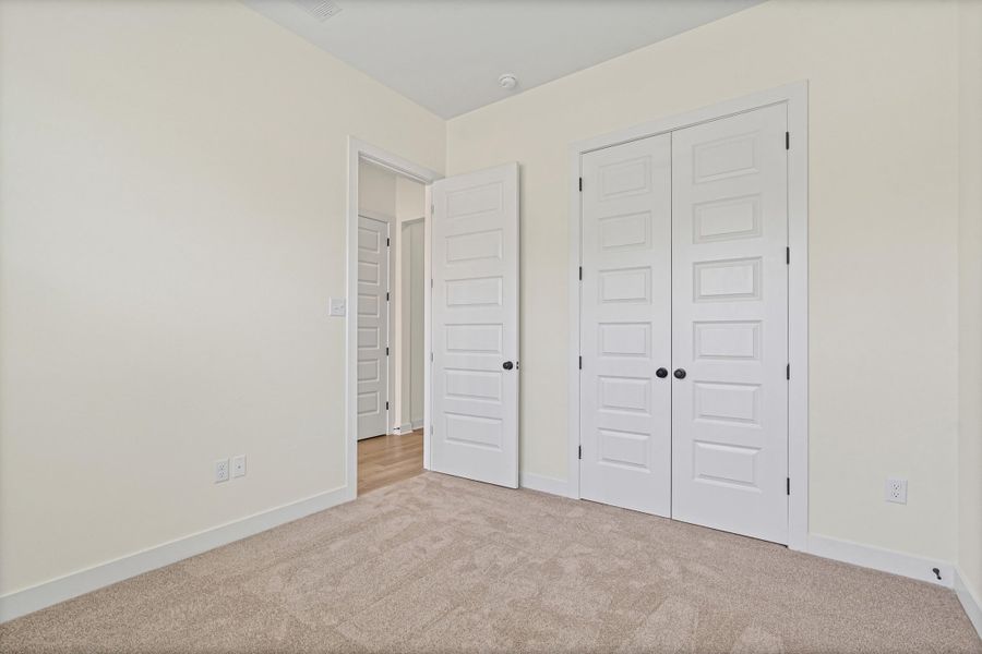 Neutral tone wall finishes complemented by white trim and a neutral tone carpet Neutral tone wall finishes complemented by white trim and a neutral tone carpet