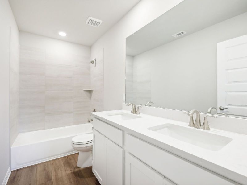 Furnished interior view inside a new home in Big Sky Ranch - Reserve Collection, Dripping Springs (Image 6).