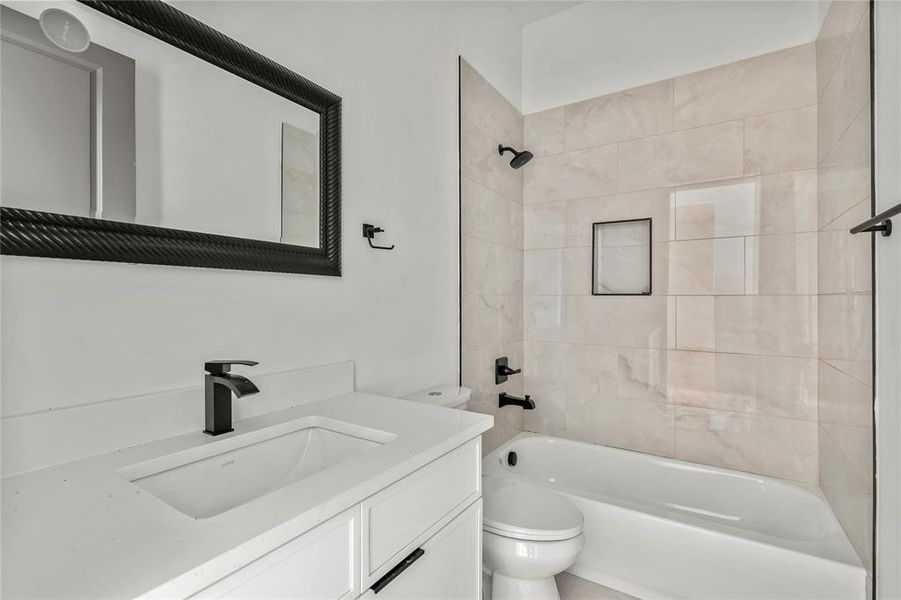 Bathroom featuring  shower combination and vanity