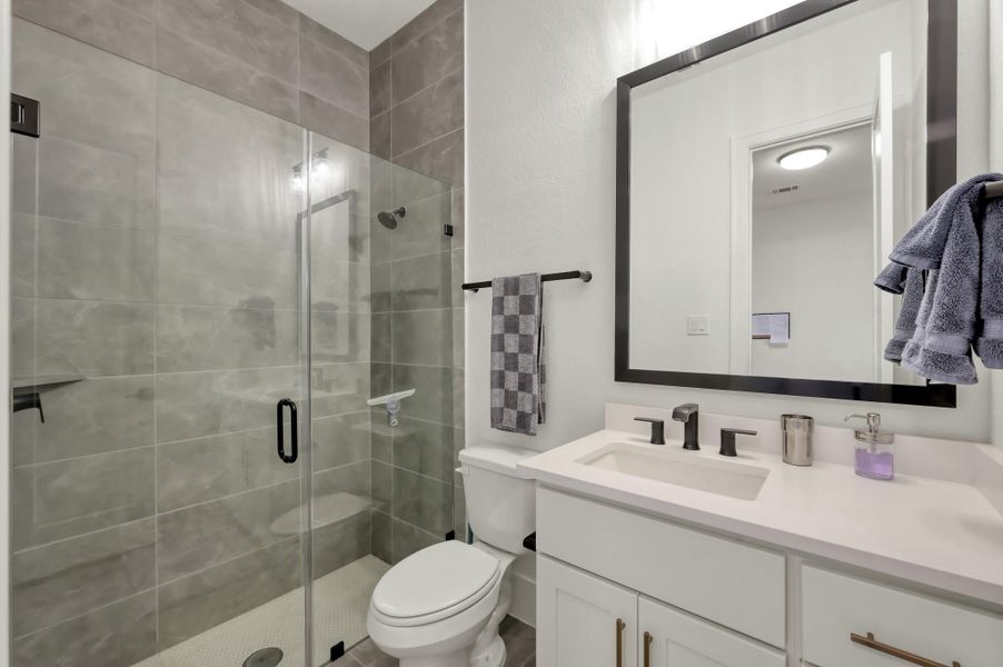 A thoughtfully designed walk-in shower in the downstairs full bath.