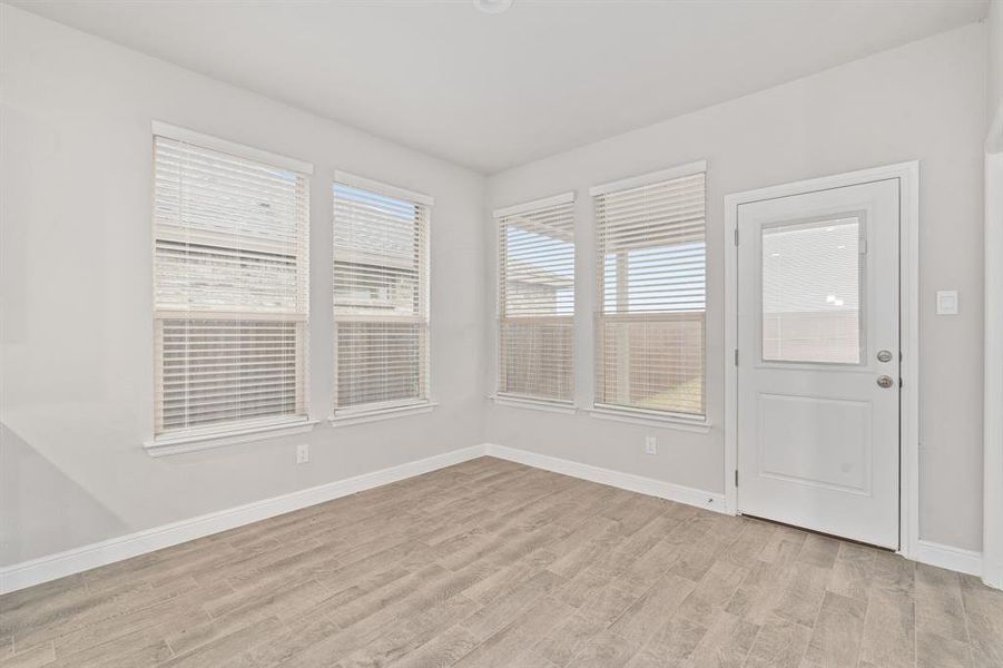 Empty room featuring light hardwood / wood-style flooring