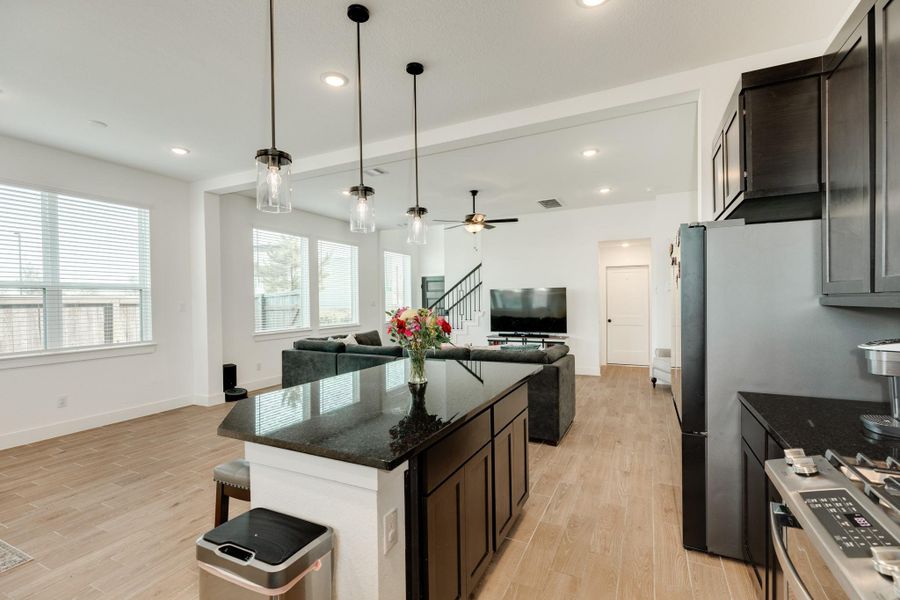 Dining area situated adjacent to the two windows overlooking the side yard.