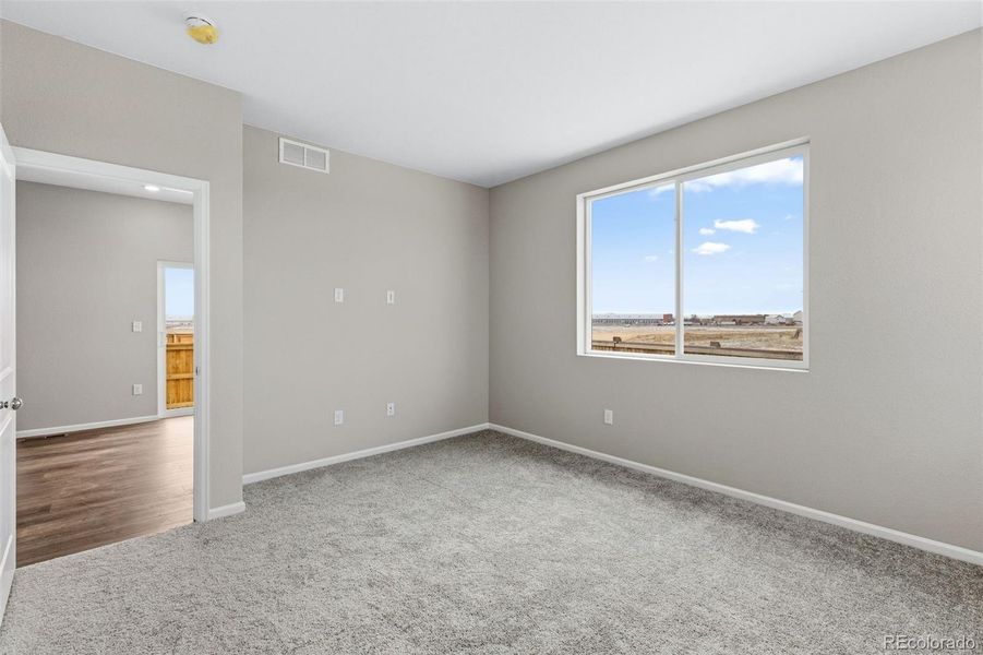 Spacious, unfurnished interior of a new home in The Cottages Collection at Ridgeline Vista, Brighton (Image 17).