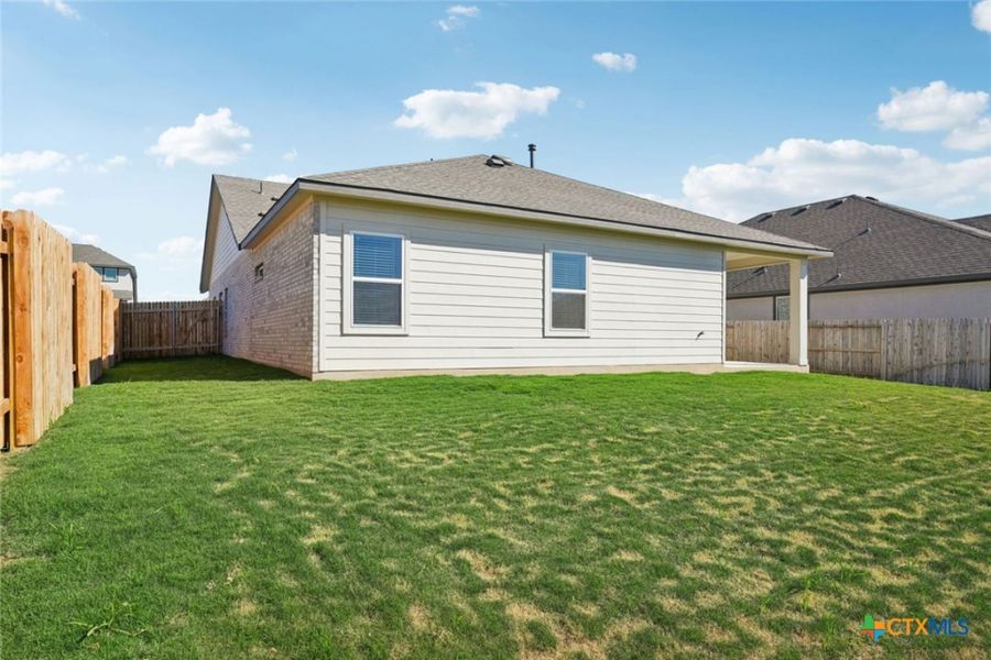 Exterior details and patio area of a home in Village at Three Oaks, Seguin (Image 20).