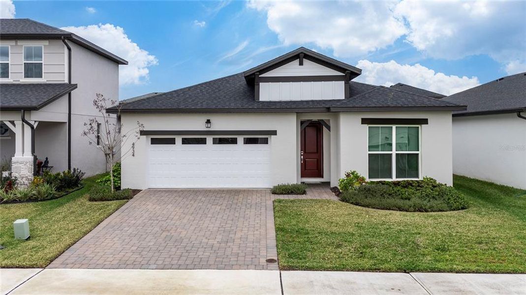 Front exterior of a new home in Havenfield at Crossprairie, St. Cloud, FL, highlighting curb appeal (Image 17).