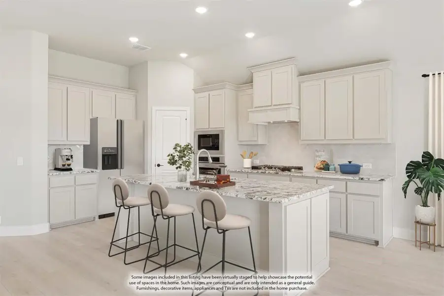 Kitchen with white cabinets, granite island, three bar stools, and stainless steel appliances on light wood floors