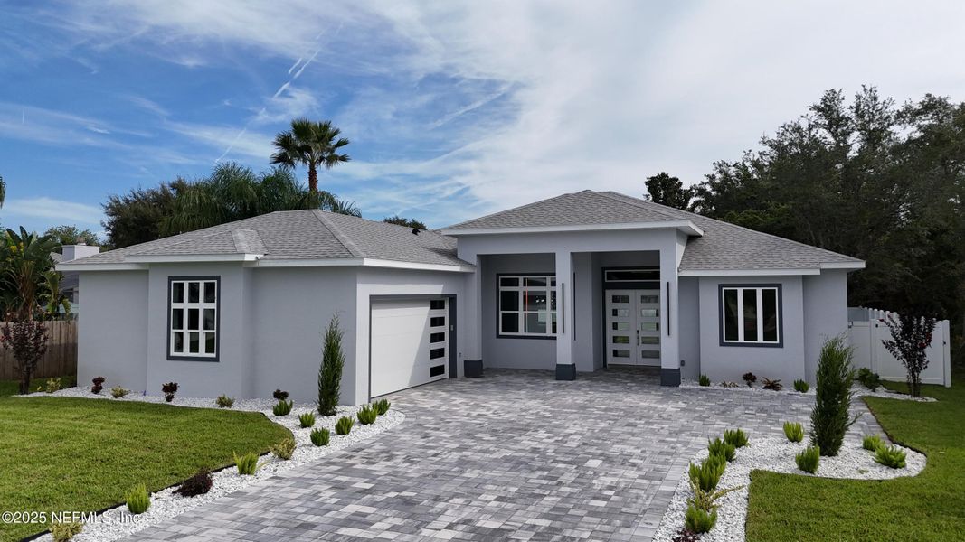 Front exterior of a new home in , Palm Coast, FL, highlighting curb appeal (Image 27). Front exterior of a new home in , Palm Coast, FL, highlighting curb appeal (Image 27).