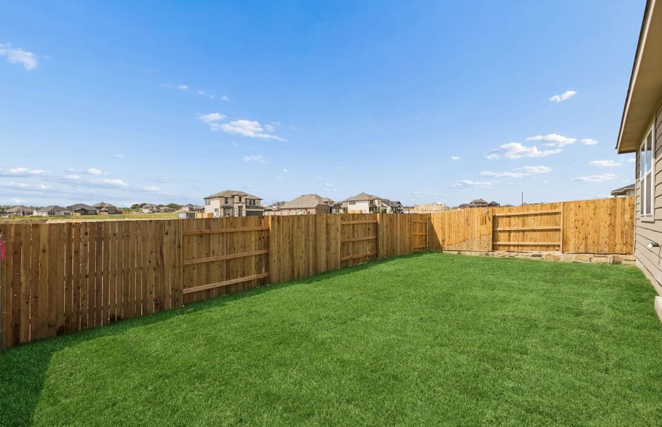 Exterior details and patio area of a home in Sunfield, Buda (Image 19).