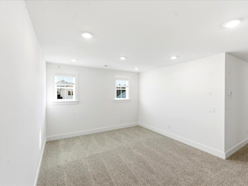 Spacious, unfurnished interior of a new home in The Coves at Lakes of Cane Bay II, Summerville (Image 28).