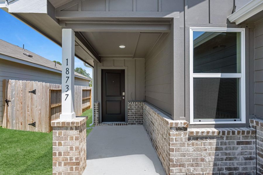 Exterior details and patio area of a home in The Enclave at Spring Branch, Conroe (Image 3).