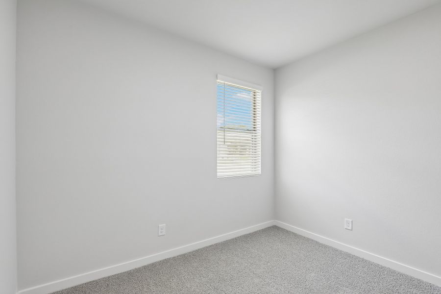 Bedroom in the Holden home plan by Trophy Signature Homes