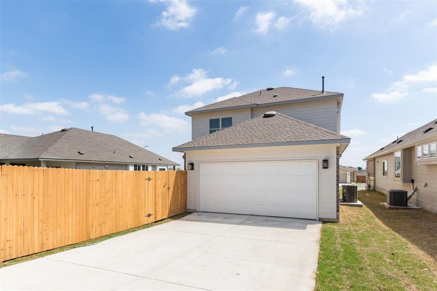 Front exterior of a new home in Saddle Creek, Georgetown, TX, highlighting curb appeal (Image 2).