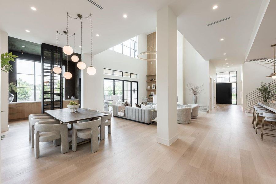 Bathed in soft natural light, this thoughtfully composed dining room blends understated luxury with everyday functionality. From intimate weekday meals to festive celebrations, the curated lighting, tailored furnishings, and built-in wine display create a backdrop worthy of every occasion.