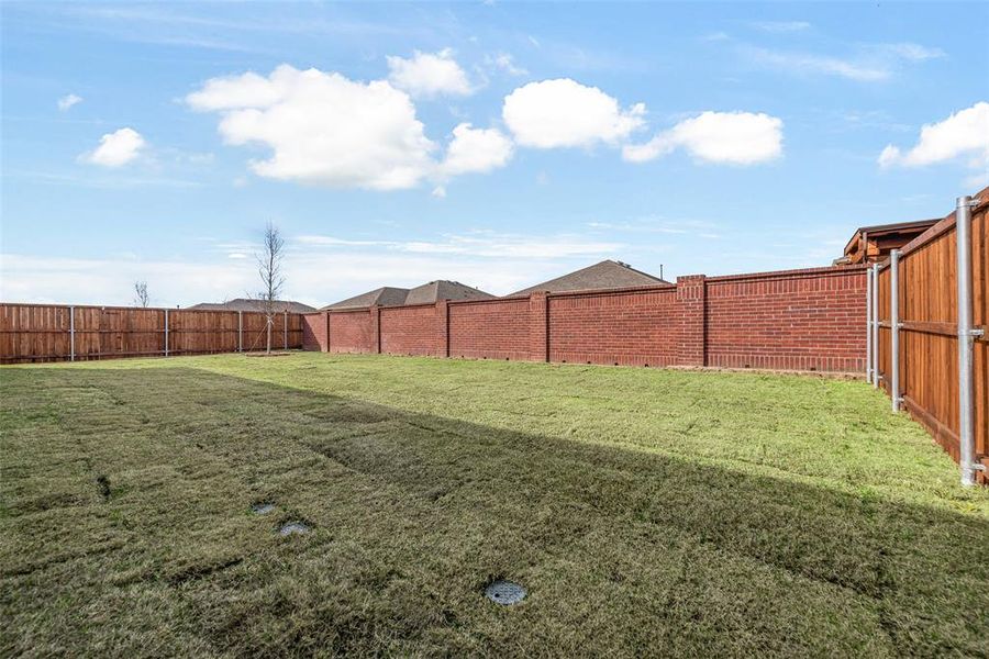 Exterior details and patio area of a home in Villages of Creekwood, Frisco (Image 3).