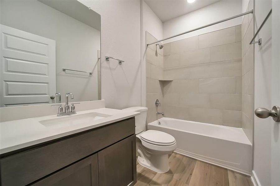 Furnished interior view inside a new home in Sunterra, Katy (Image 49).