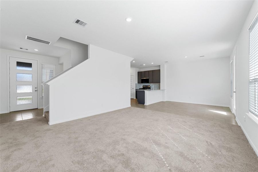 Stunning open-concept design seamlessly connecting the living, dining, and kitchen areas—perfect for both everyday living and entertaining!