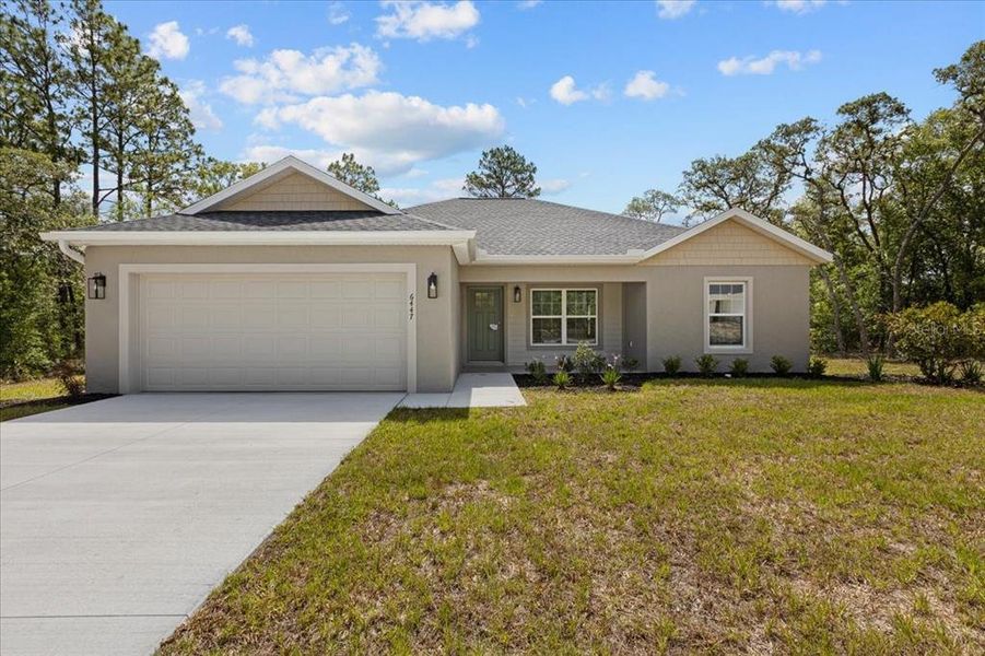 Front exterior of a new home in , Citrus Springs, FL, highlighting curb appeal (Image 25).