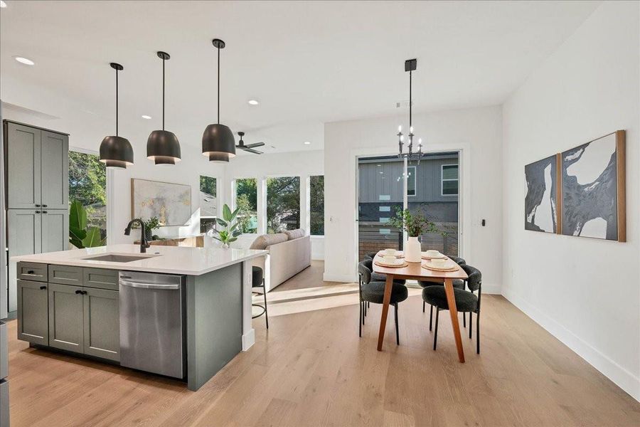 Kitchen, dining and living spaces make up the first floor of this gorgeous new construction home