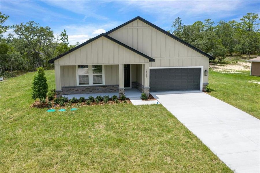 Front exterior of a new home in , Weeki Wachee, FL, highlighting curb appeal (Image 26).