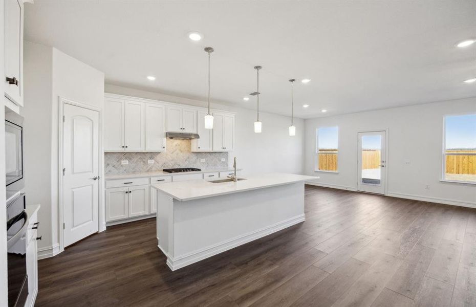 Bright kitchen with ample cabinet space *real home pictured