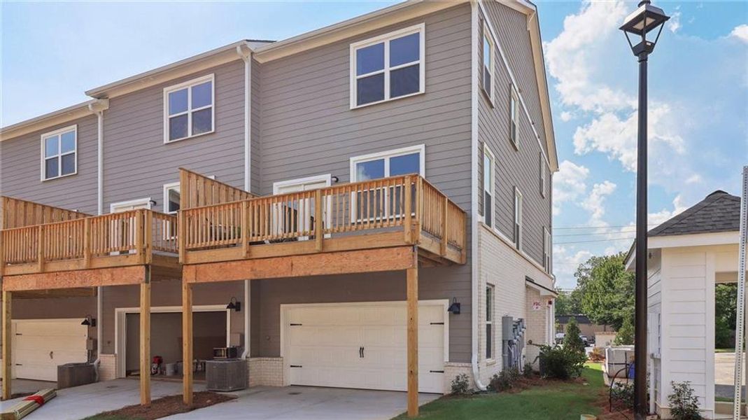 Exterior details and patio area of a home in Townes at Asbury, Hapeville (Image 20).