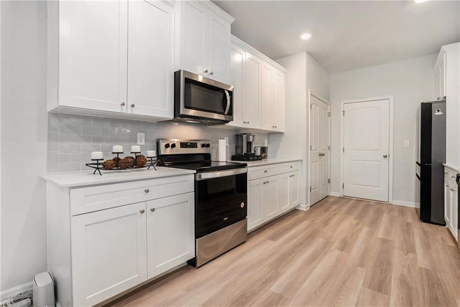Furnished interior view inside a new home in Adagio, Dacula (Image 24).