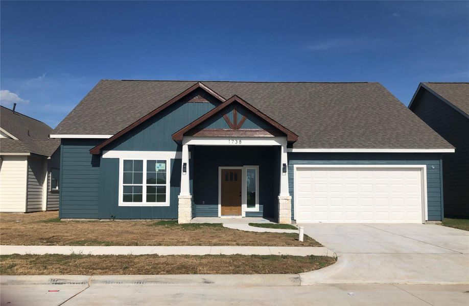 Front exterior of a new home in , El Campo, TX, highlighting curb appeal (Image 1). Front exterior of a new home in , El Campo, TX, highlighting curb appeal (Image 1).