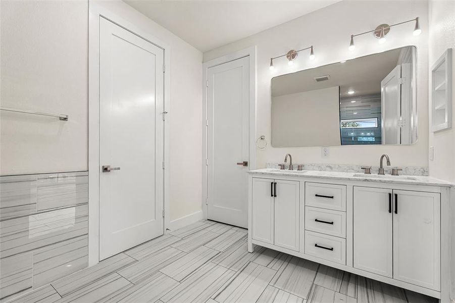 Full bathroom featuring double vanity Full bathroom featuring double vanity