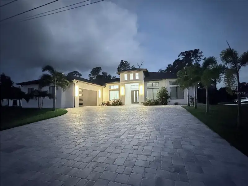 Exterior details and patio area of a home in , North Port (Image 35).