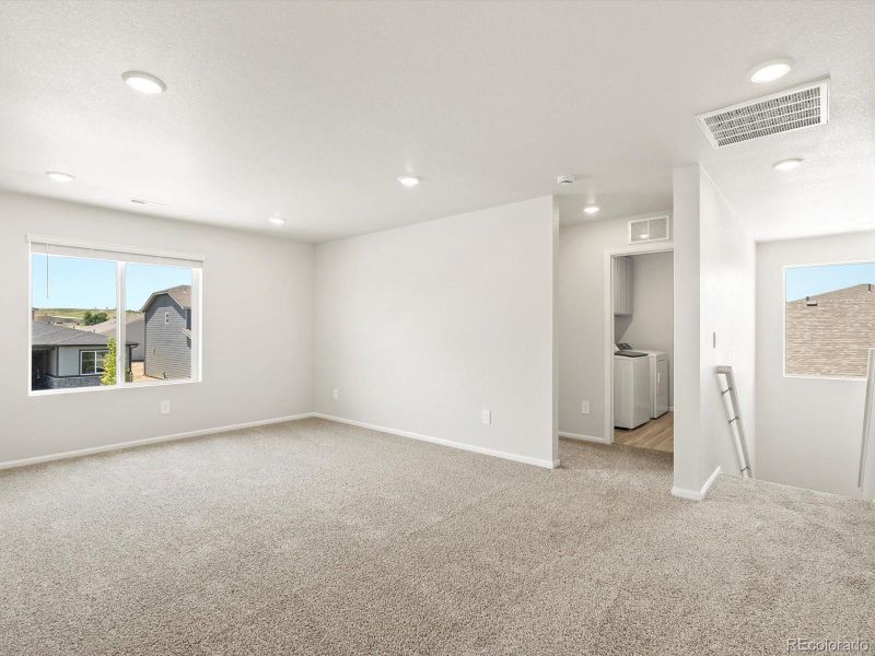 Spacious, unfurnished interior of a new home in Poudre Heights: The Lakes Collection, Windsor (Image 36).