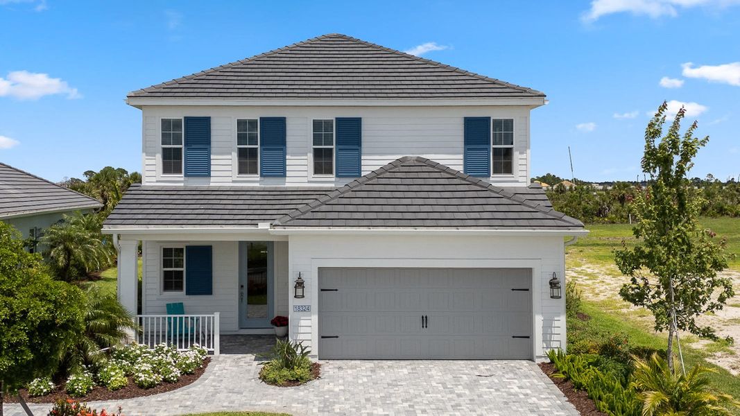 Front exterior of a new home in Palmera, Venice, FL, highlighting curb appeal (Image 2). Front exterior of a new home in Palmera, Venice, FL, highlighting curb appeal (Image 2).