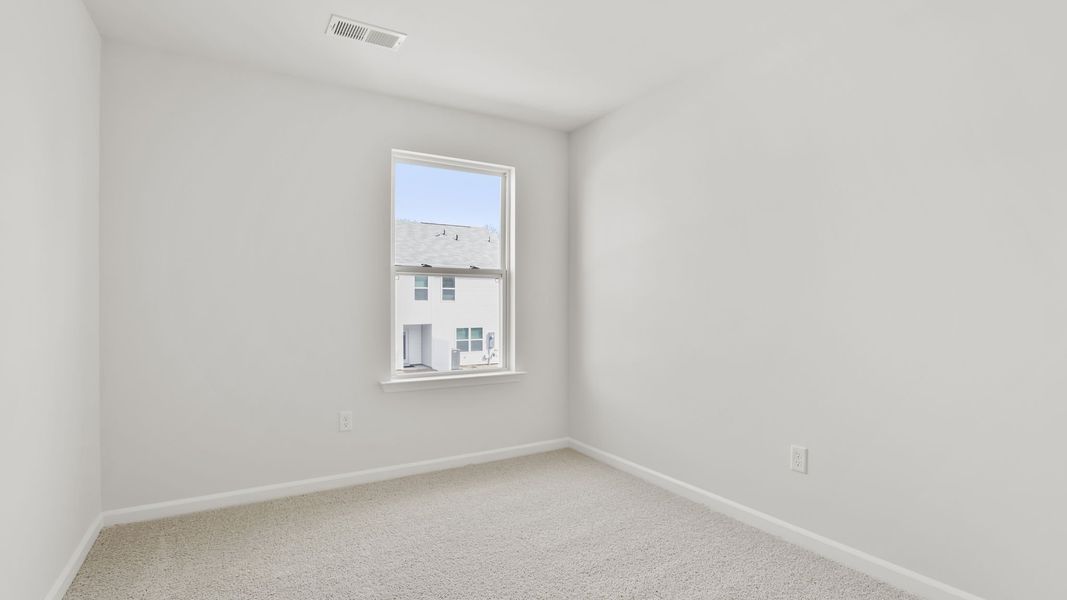 Spacious, unfurnished interior of a new home in Tanglewood Townes, Greenville (Image 21).