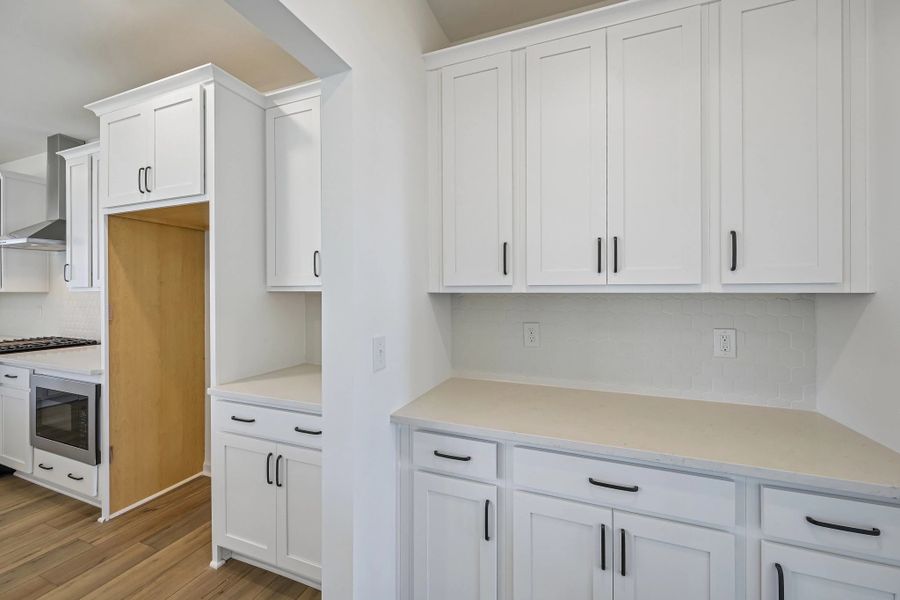 Butler’s Pantry featuring the AW Collection® Harmony - Classic storage with polished finishes.