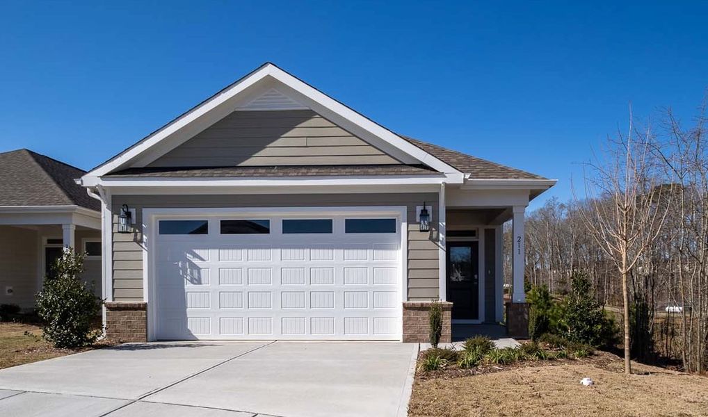 Representative exterior photo of a completed home built from the Camellia by McKee Homes in The Walk at East Village, Clayton, NC (Image 2). Representative exterior photo of a completed home built from the Camellia by McKee Homes in The Walk at East Village, Clayton, NC (Image 2).