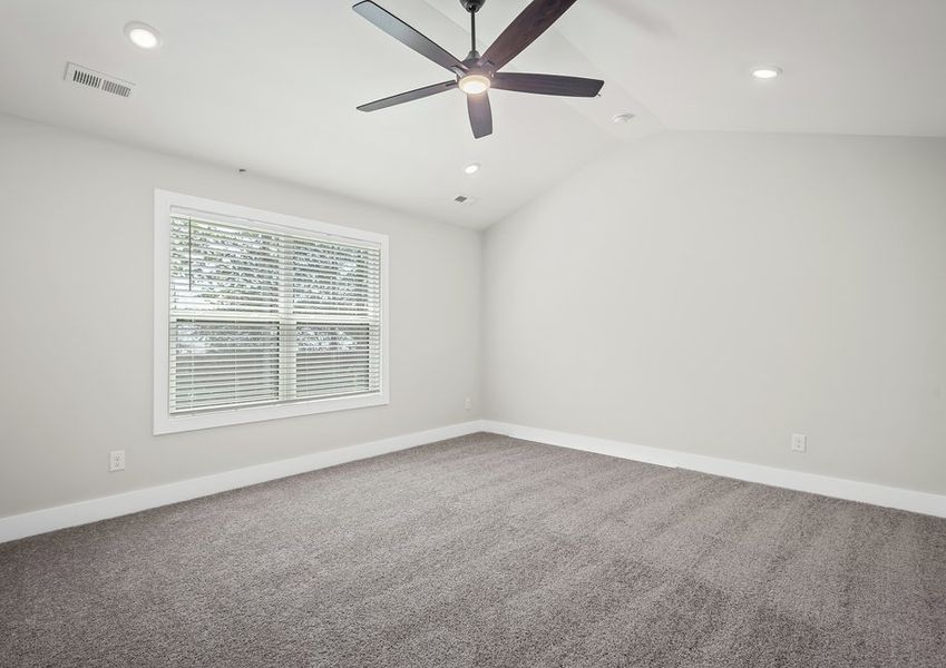 Rest and relaxation await in the primary bedroom