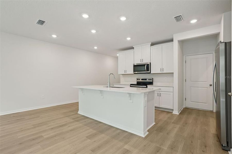 Furnished interior view inside a new home in Bradford Park, Ormond Beach (Image 6).